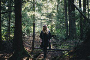 Red haired woman in woods Point Defiance Park Tacoma ,WA