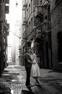 bride and groom posing in Pioneer Square Seattle, WA