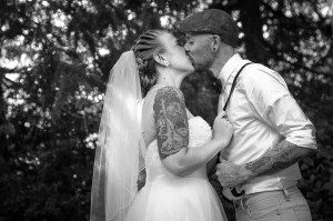 Newlyweds kissing in black and white Gig Harbor wedding