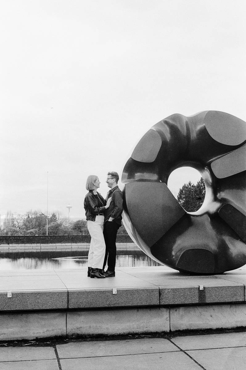 Film engagement portrait with Seattle city scenery
